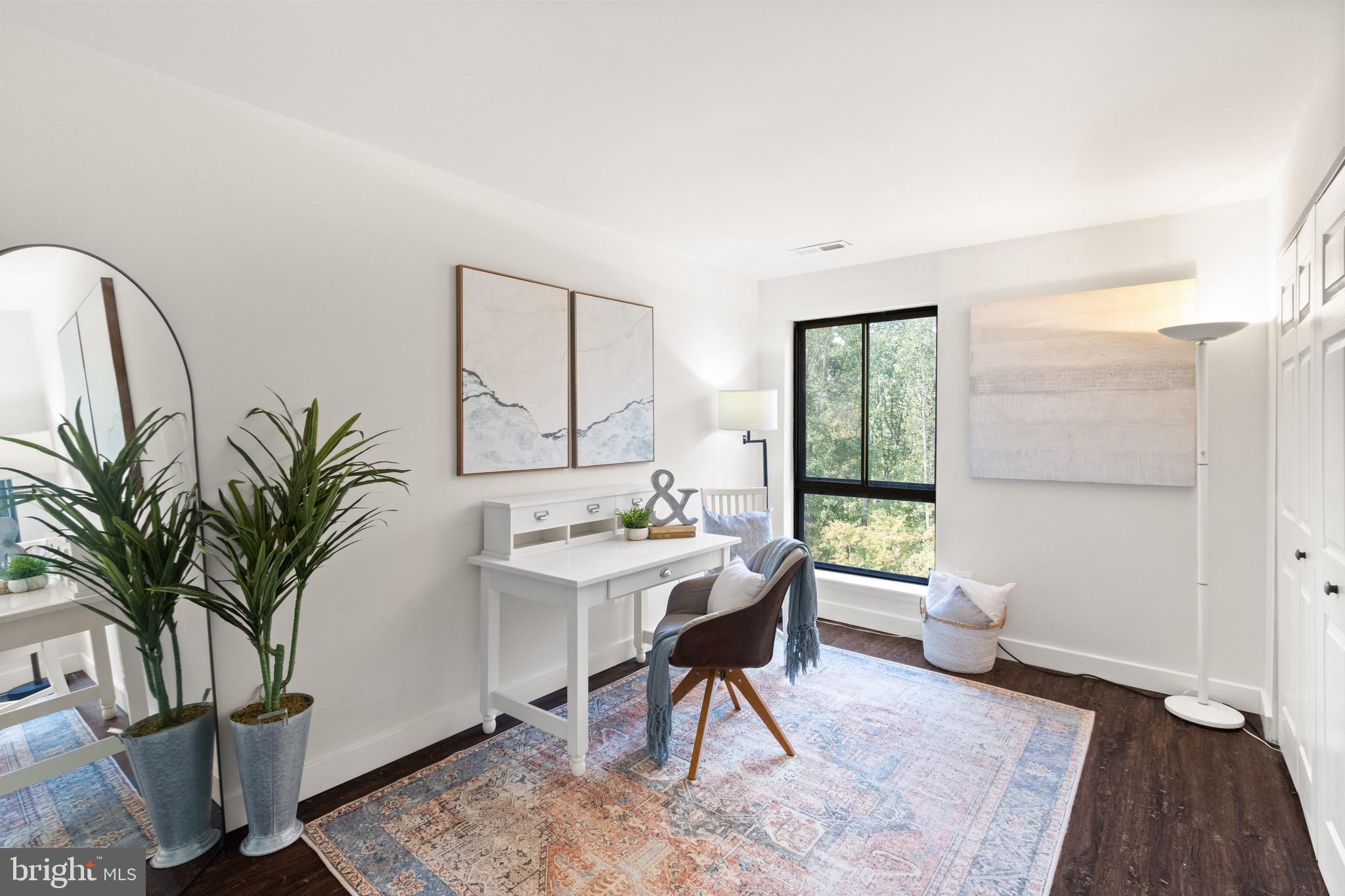11240 Chestnut Grove Square, Unit 358 Reston, VA 20190 - Photo 18 of 31 a workspace with furniture and a potted plant