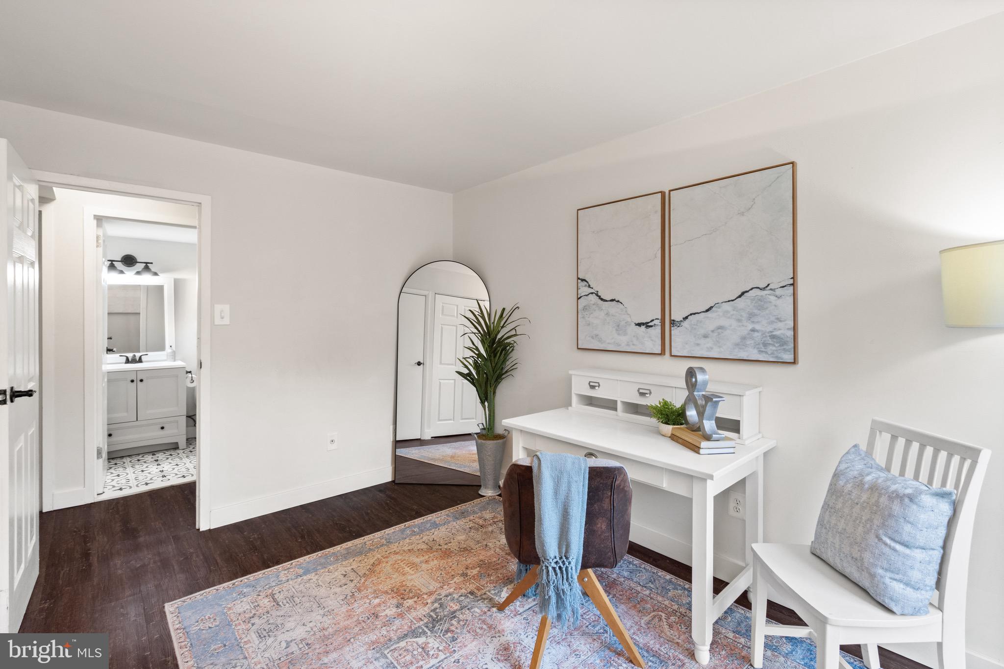 11240 Chestnut Grove Square, Unit 358 Reston, VA 20190 - Photo 19 of 31 a living room with furniture and wooden floor