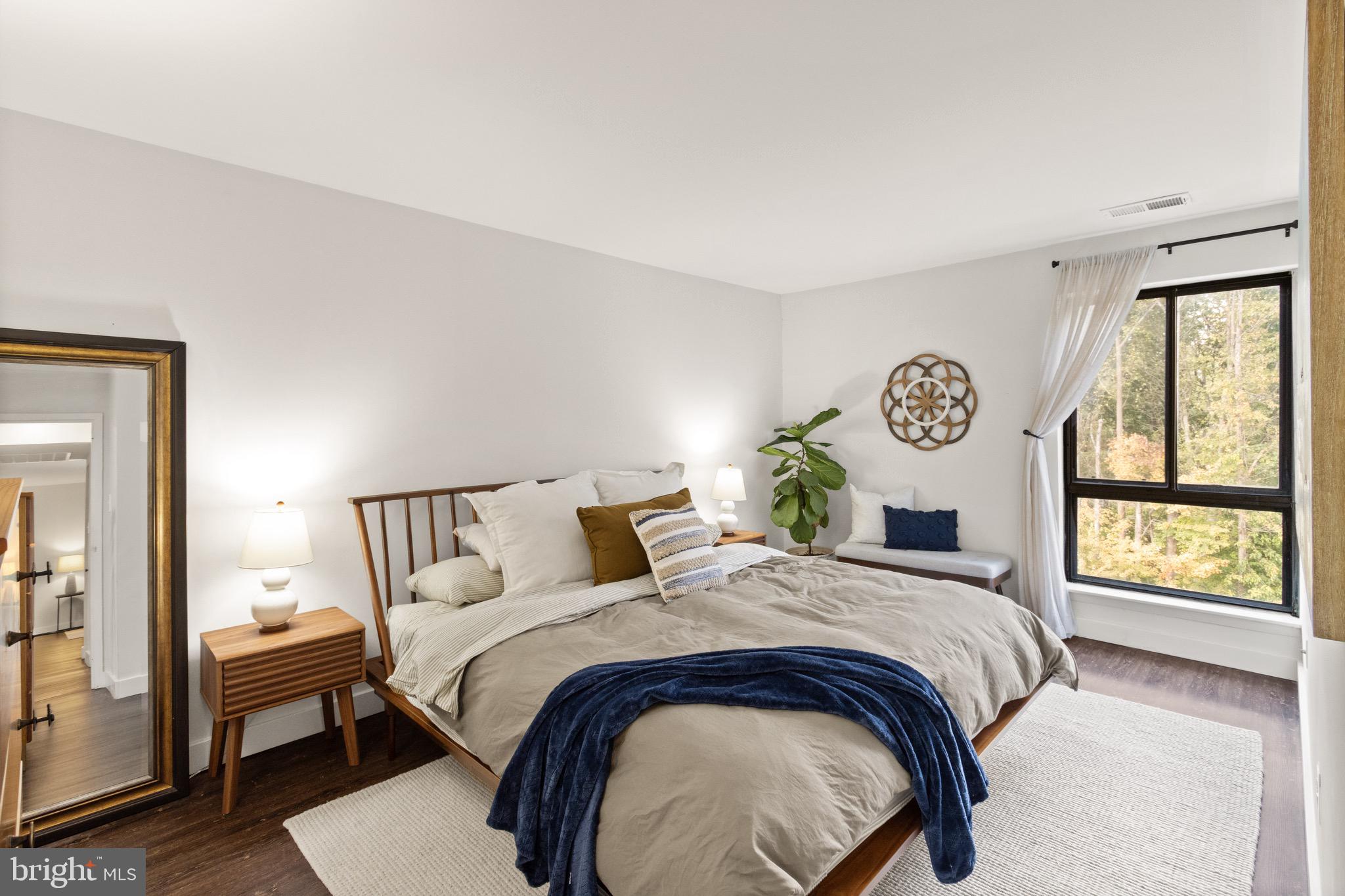 11240 Chestnut Grove Square, Unit 358 Reston, VA 20190 - Photo 20 of 31 a bedroom with a bed and a window