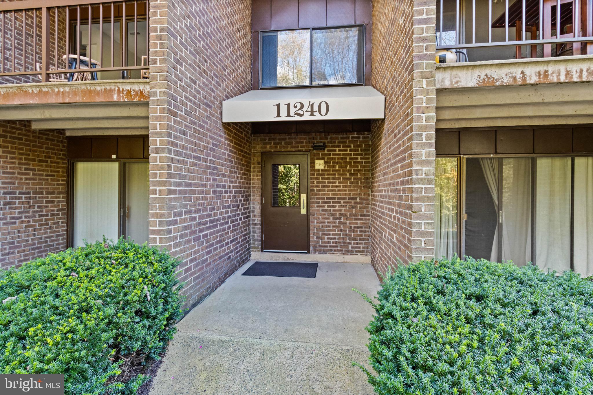 11240 Chestnut Grove Square, Unit 358 Reston, VA 20190 - Photo 2 of 31 a view of a entrance of the building
