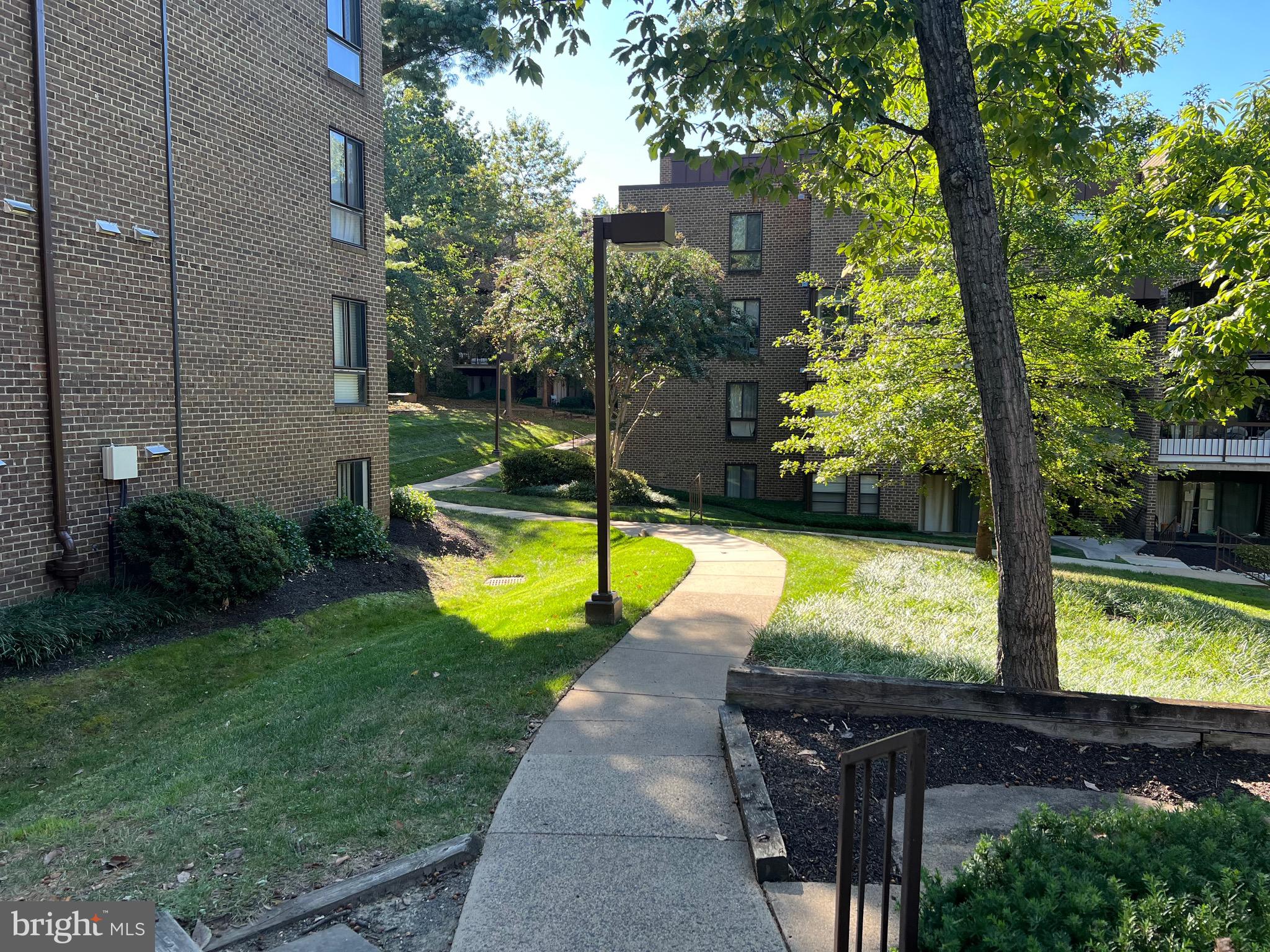11240 Chestnut Grove Square, Unit 358 Reston, VA 20190 - Photo 30 of 31 a view of a backyard with swimming pool