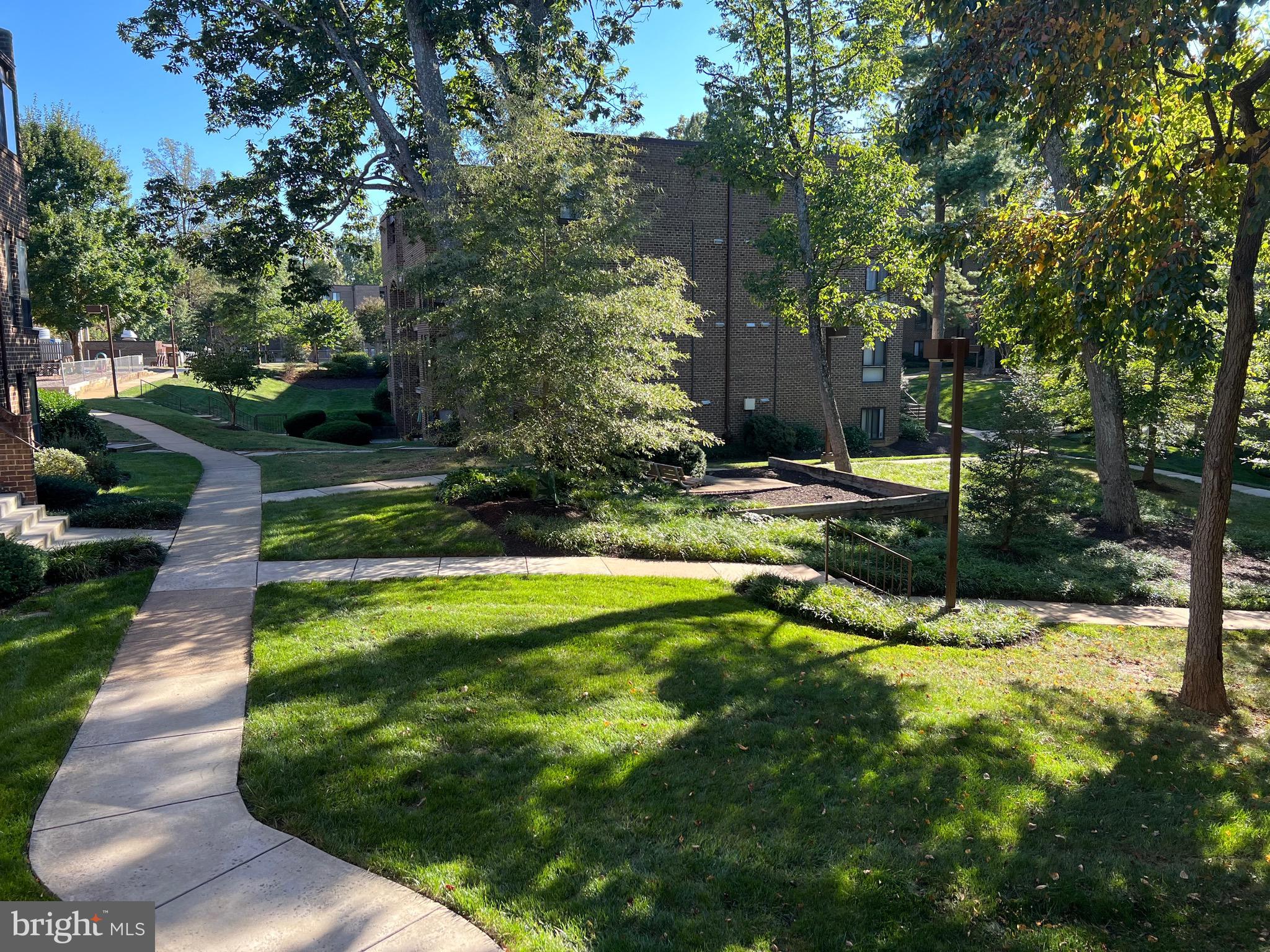 11240 Chestnut Grove Square, Unit 358 Reston, VA 20190 - Photo 31 of 31 a view of a park with large trees