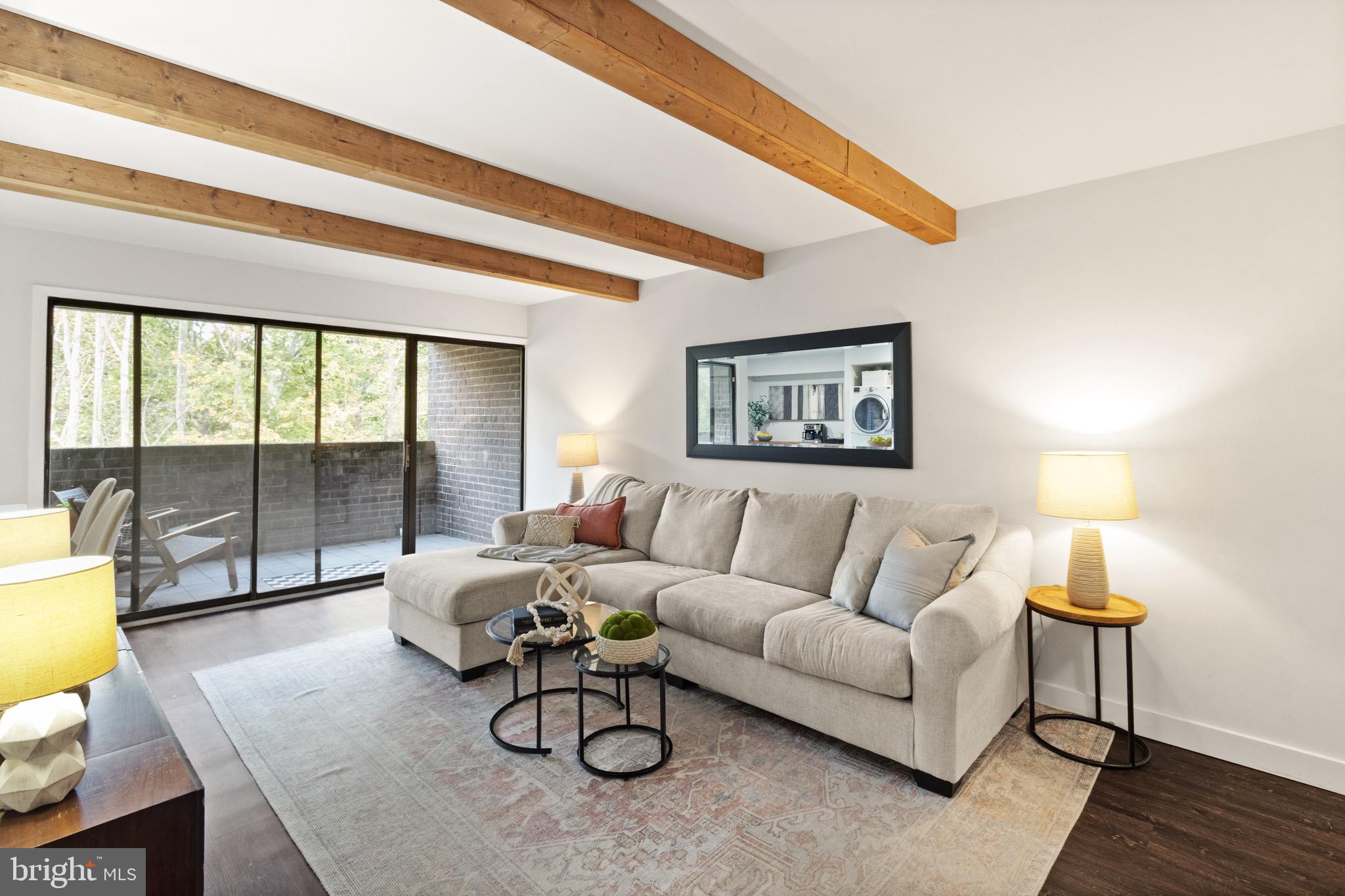 11240 Chestnut Grove Square, Unit 358 Reston, VA 20190 - Photo 4 of 31 a living room with furniture and a floor to ceiling window