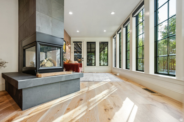 1141 South Oak Leaf Lane Springville, UT 84663 - Photo 55 of 147 Three-sided glass fireplace with a stone surround