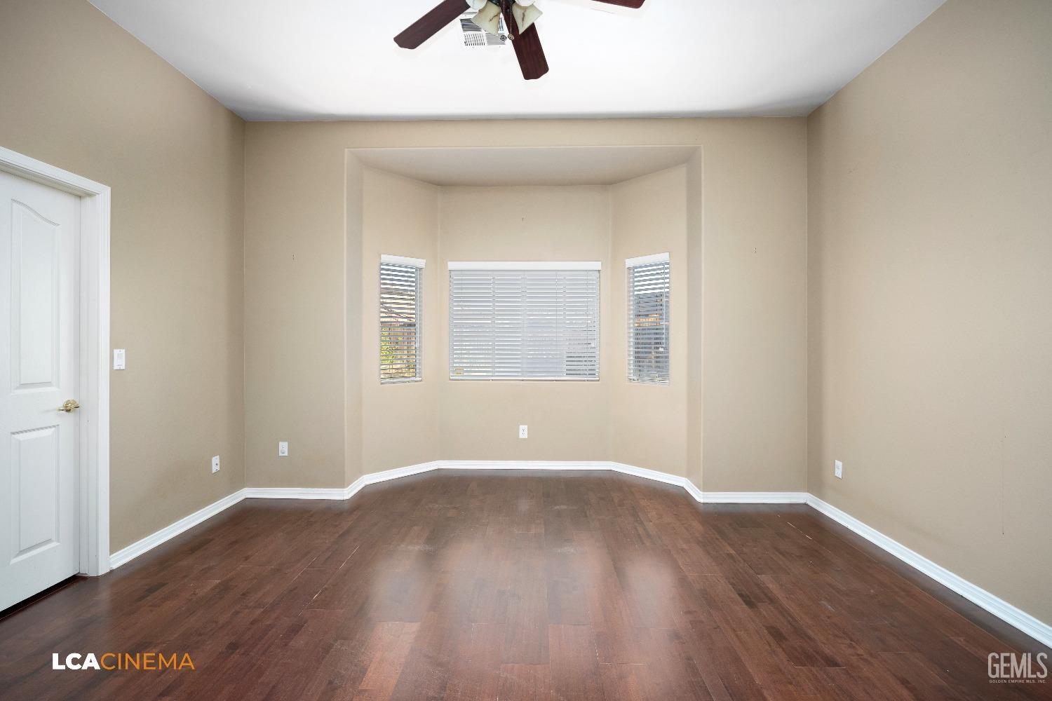 Undisclosed Address Bakersfield, CA 93312 - Photo 13 of 21 wooden floor in an empty room with a window