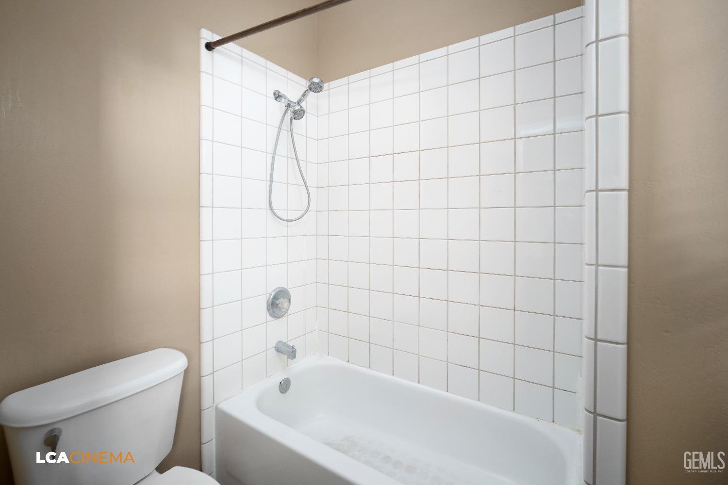 Undisclosed Address Bakersfield, CA 93312 - Photo 16 of 21 a bathroom with a bathtub and shower