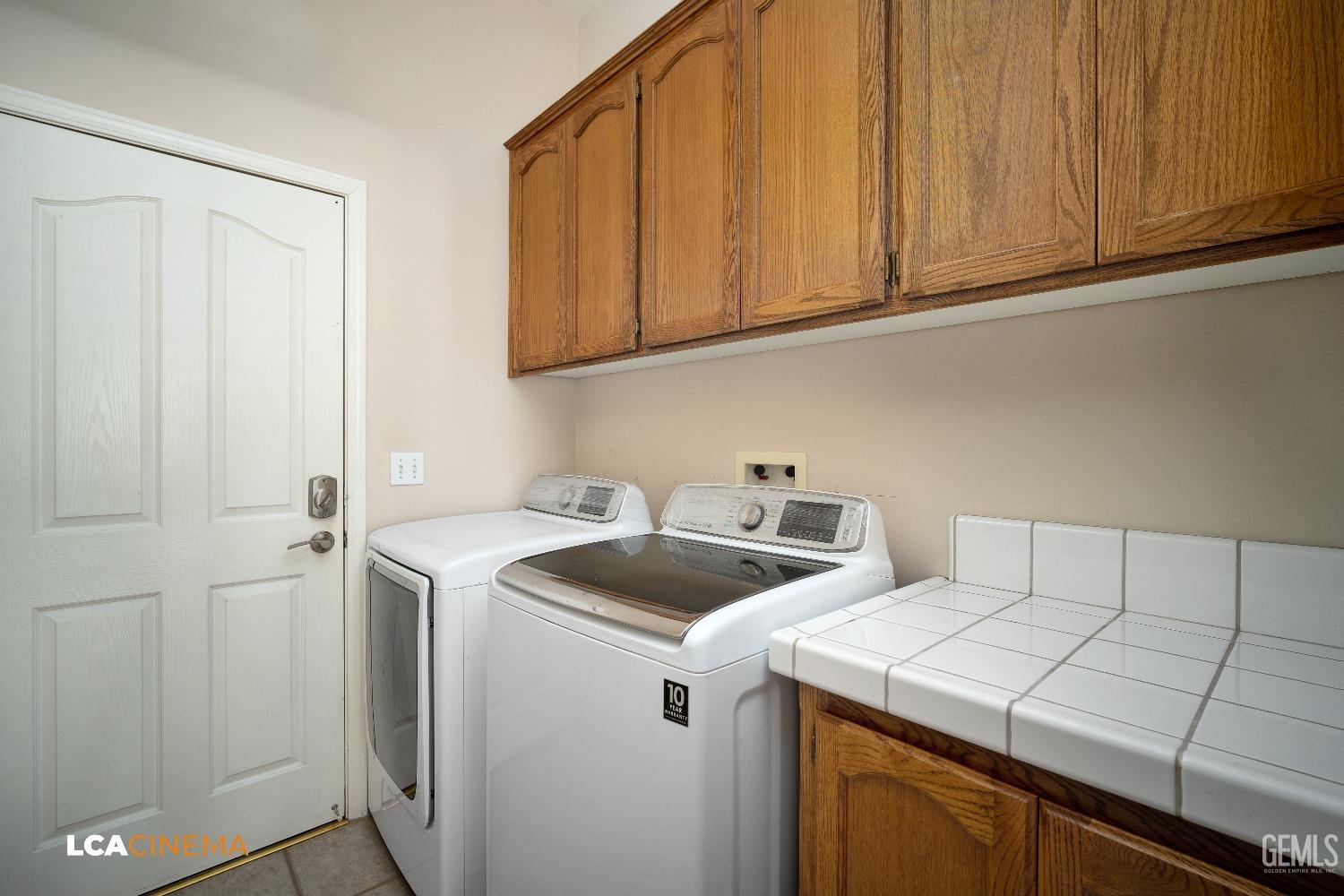 Undisclosed Address Bakersfield, CA 93312 - Photo 18 of 21 a utility room with dryer and washer