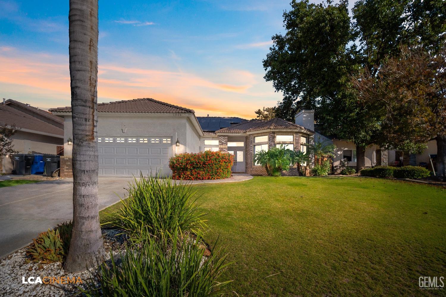 Undisclosed Address Bakersfield, CA 93312 - Photo 2 of 21 a view of a garden with a tree