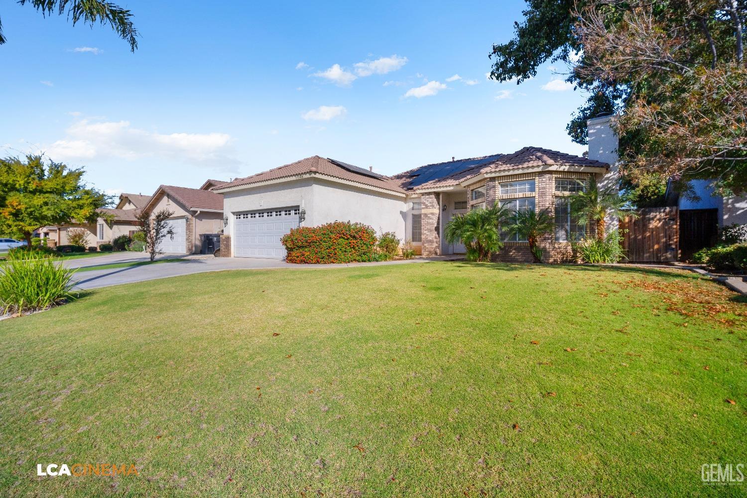 Undisclosed Address Bakersfield, CA 93312 - Photo 3 of 21 a view of a house with a yard and potted plants
