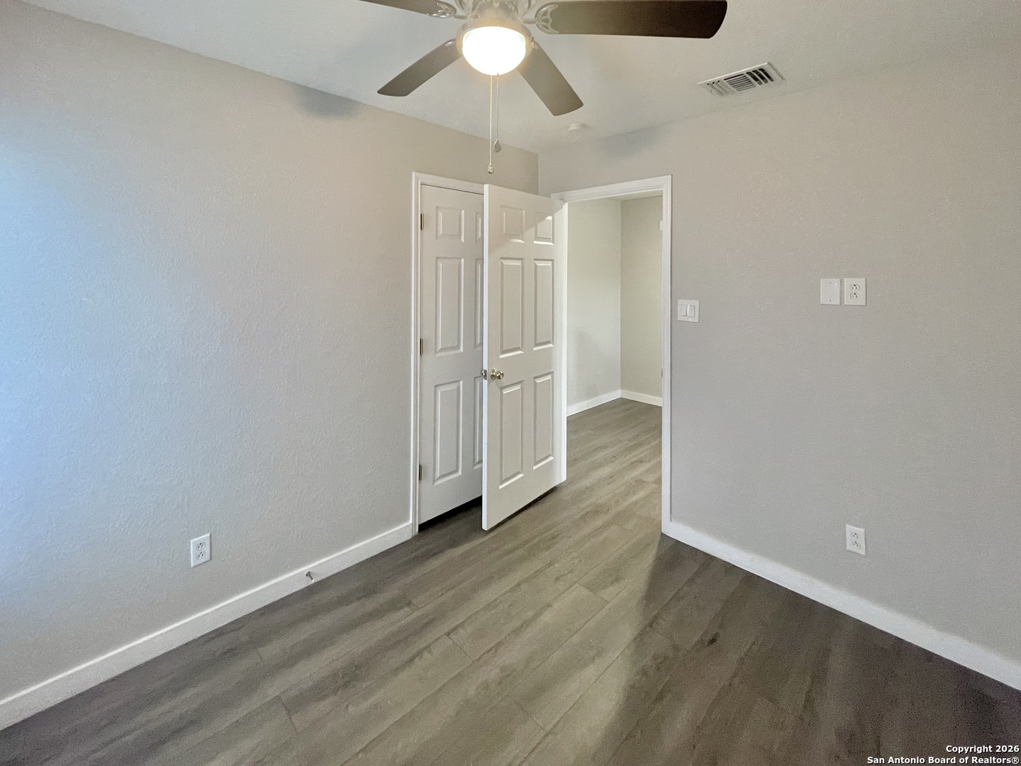 6938 Crestway Road, Unit 1 San Antonio, TX 78239 - Photo 12 of 16 wooden floor in an empty room