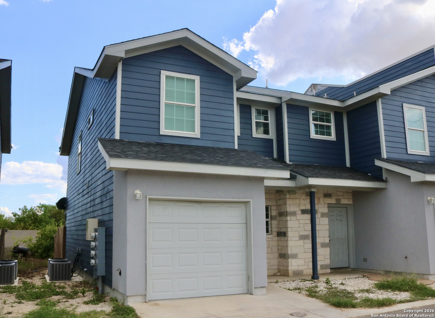 6938 Crestway Road, Unit 1 San Antonio, TX 78239 - Photo 2 of 16 a front view of a house with entertaining space