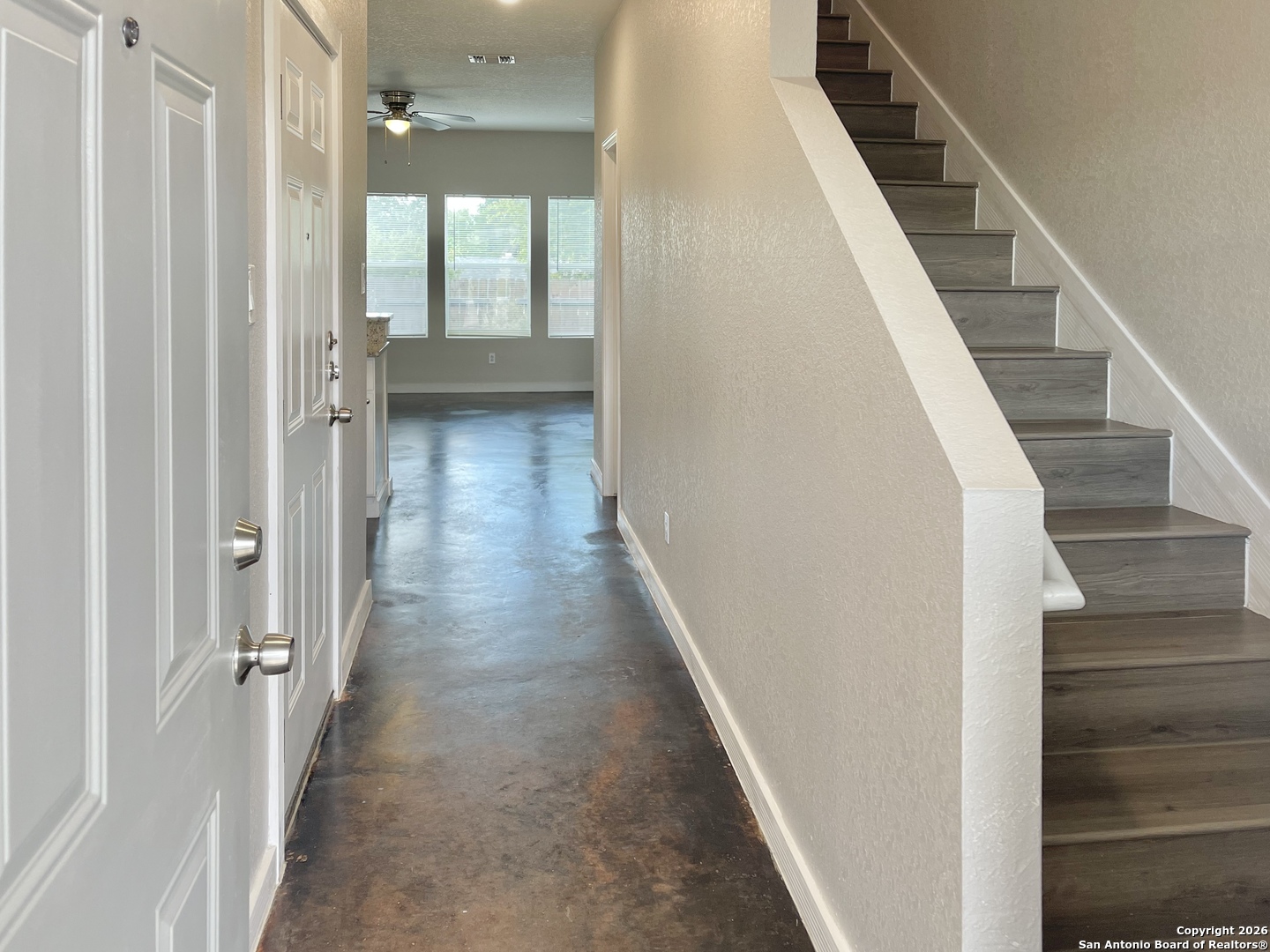 6938 Crestway Road, Unit 1 San Antonio, TX 78239 - Photo 3 of 16 a view of a hallway with wooden floor and entryway