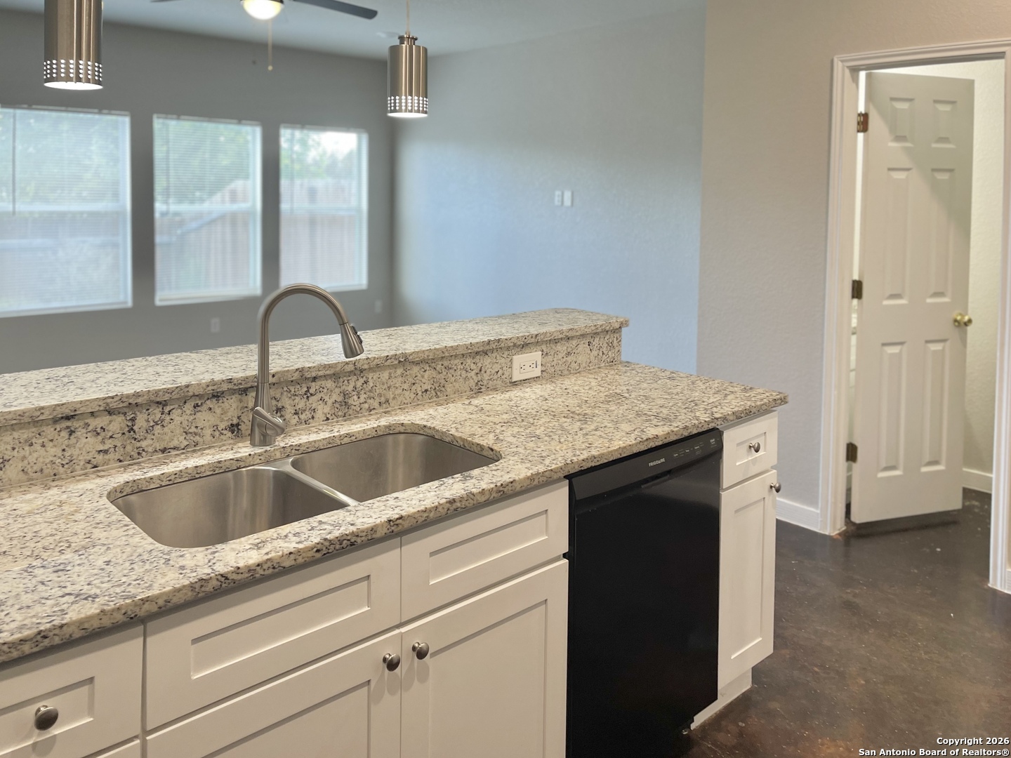 6938 Crestway Road, Unit 1 San Antonio, TX 78239 - Photo 5 of 16 a kitchen with a sink and a wooden floor