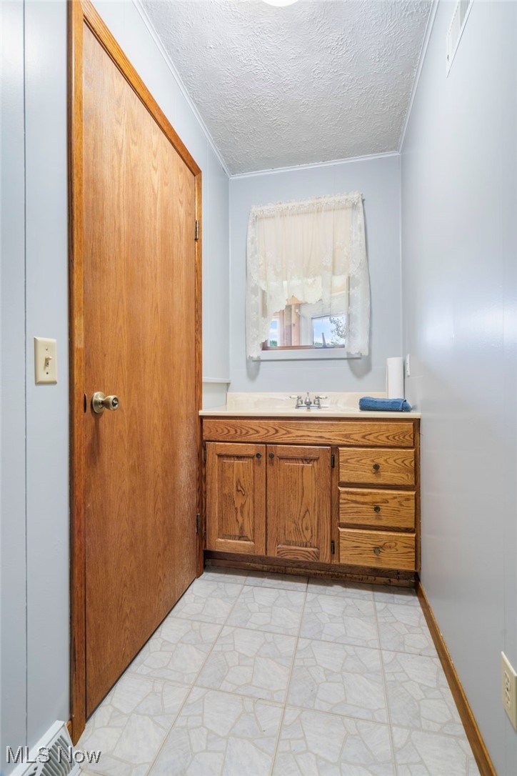 4246 Caddy Road Southwest Bowerston, OH 44695 - Photo 14 of 42 1/2 bath coming in from the garage