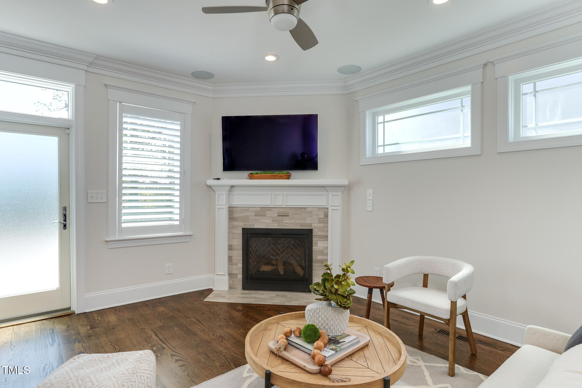 721 Shelley Road Raleigh, NC 27609 - Photo 16 of 46 a living room with furniture fireplace and window