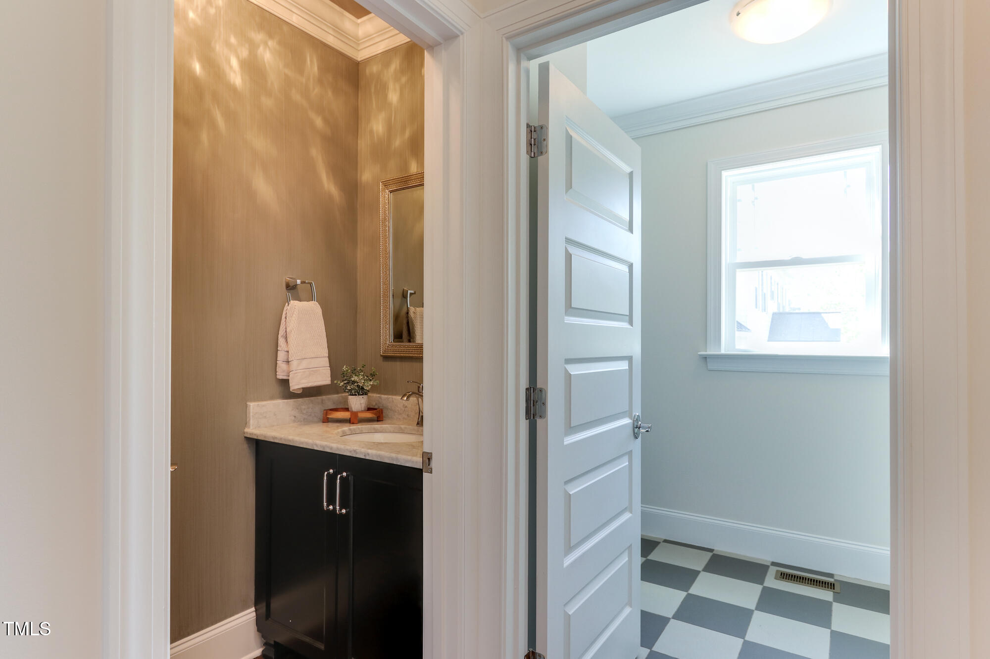 721 Shelley Road Raleigh, NC 27609 - Photo 18 of 46 a view of a bathroom with a sink