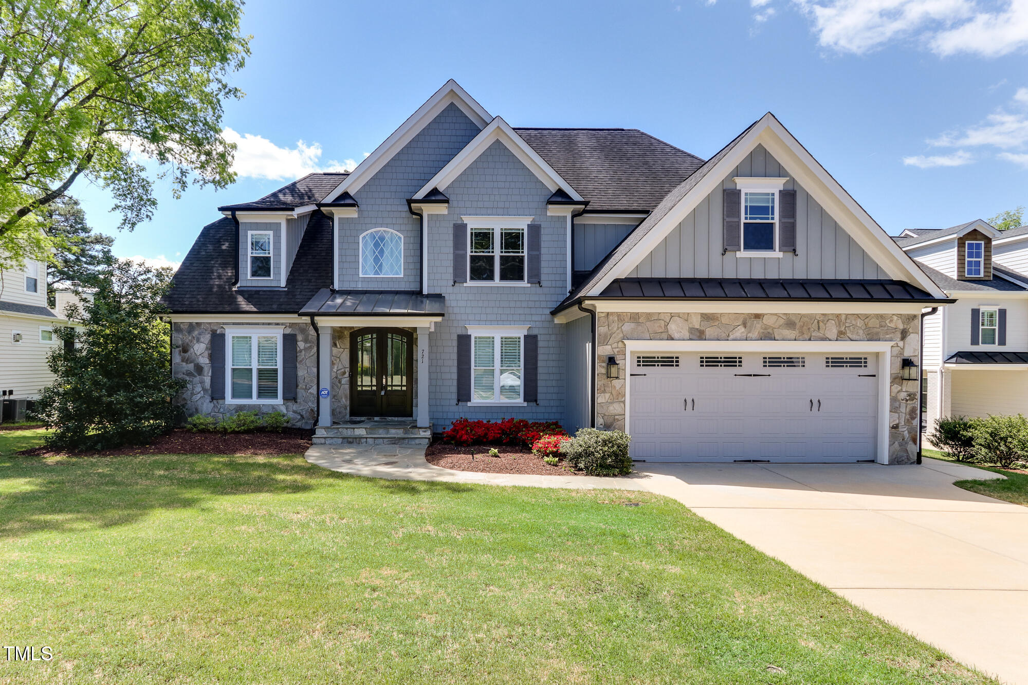 721 Shelley Road Raleigh, NC 27609 - Photo 2 of 46 a front view of a house with yard and garage