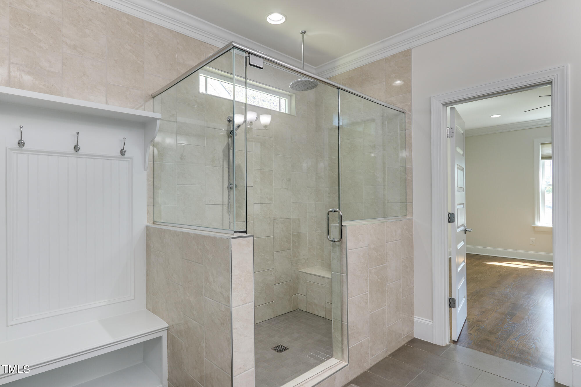 721 Shelley Road Raleigh, NC 27609 - Photo 22 of 46 a bathroom with a shower and a glass door