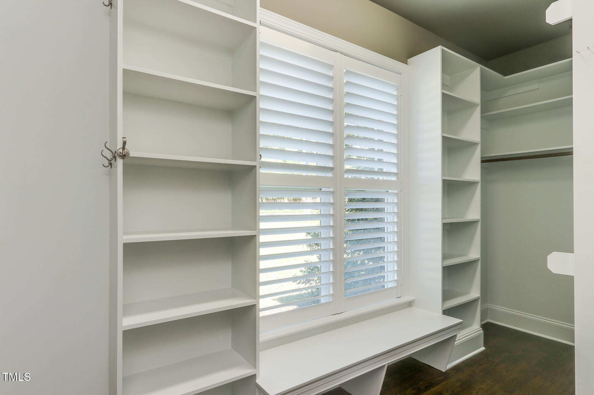 721 Shelley Road Raleigh, NC 27609 - Photo 23 of 46 a view of walk in closet with empty racks
