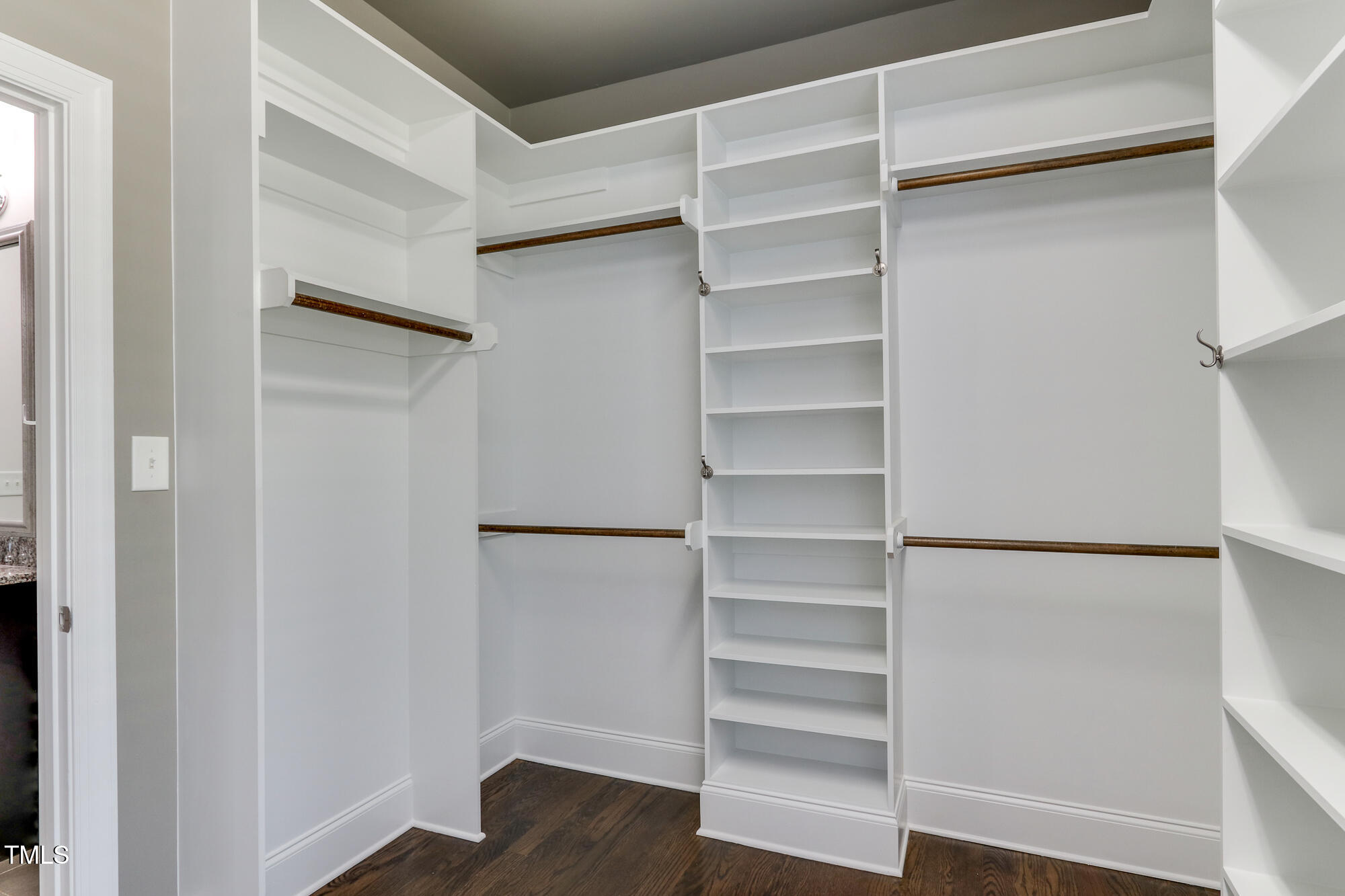 721 Shelley Road Raleigh, NC 27609 - Photo 24 of 46 a view of walk in closet with empty racks