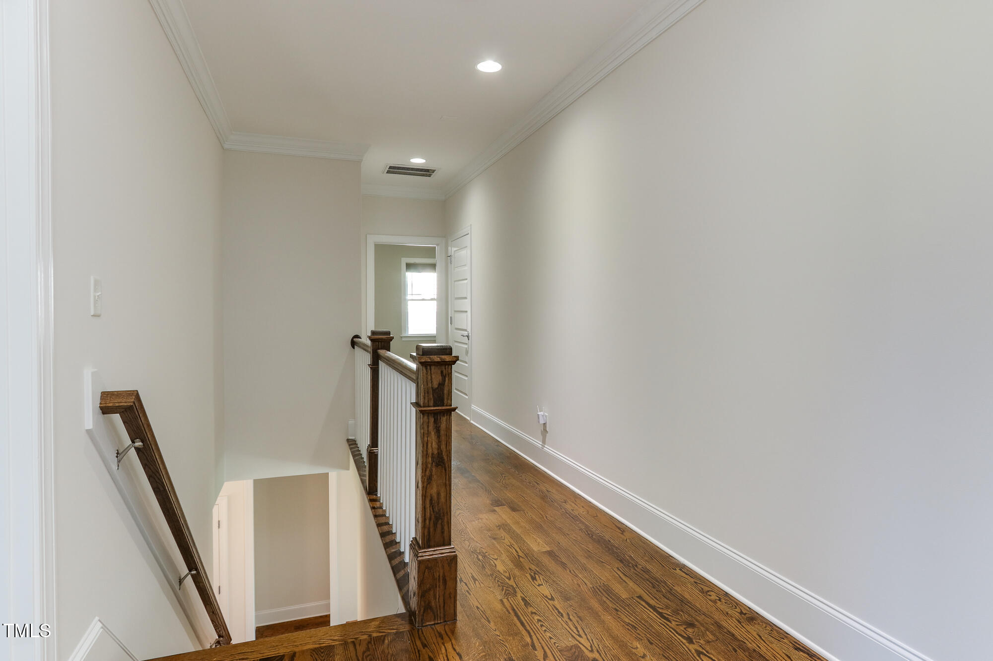 721 Shelley Road Raleigh, NC 27609 - Photo 25 of 46 a view of a hallway with stairs