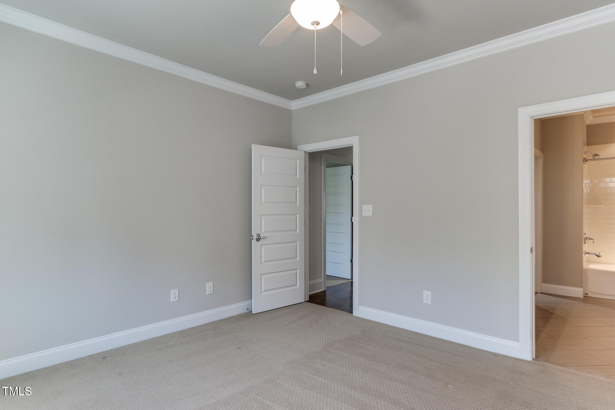721 Shelley Road Raleigh, NC 27609 - Photo 28 of 46 an empty room with a ceiling fan and a window