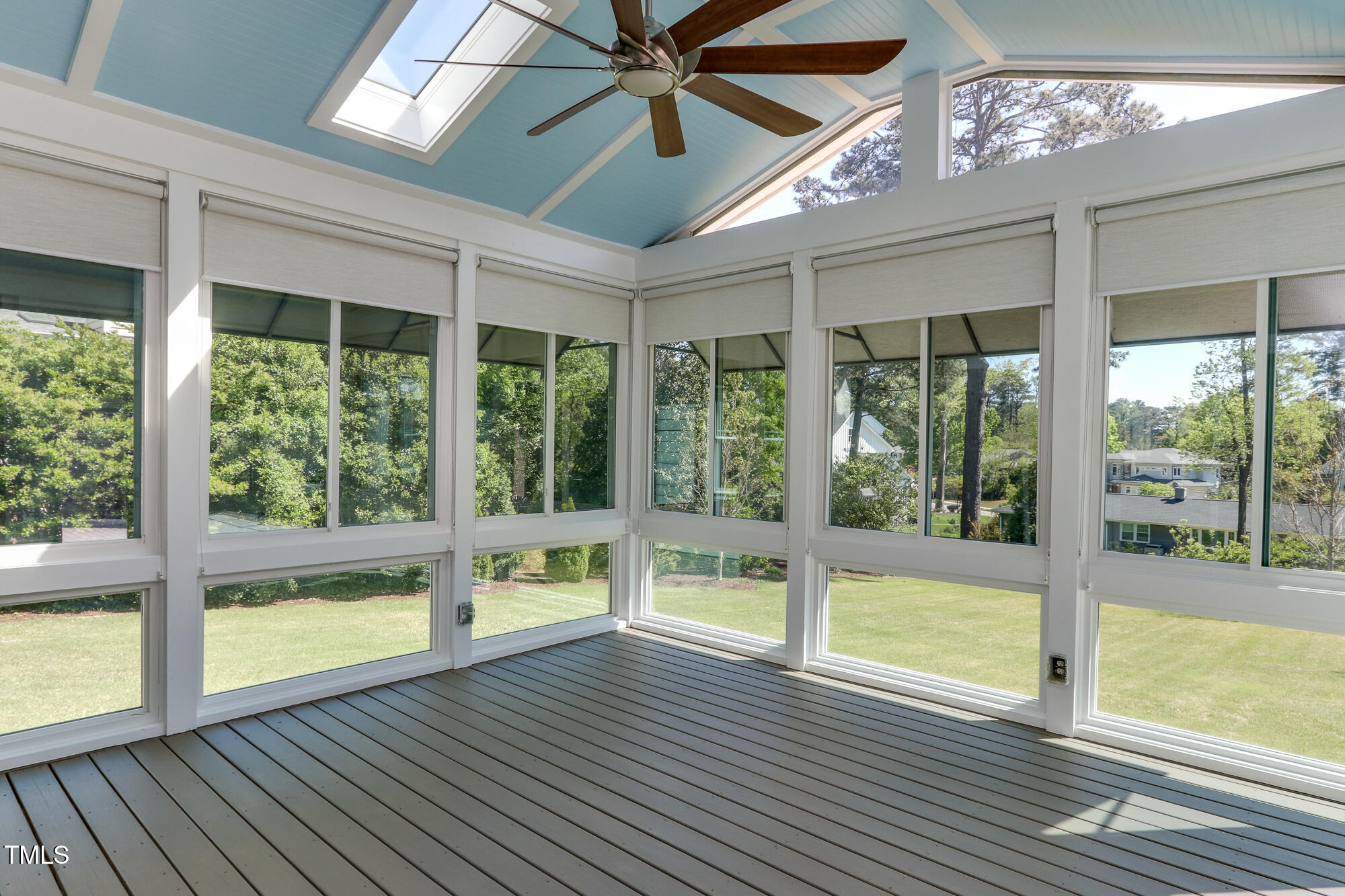 721 Shelley Road Raleigh, NC 27609 - Photo 36 of 46 a view of an empty room with wooden floor and a large window