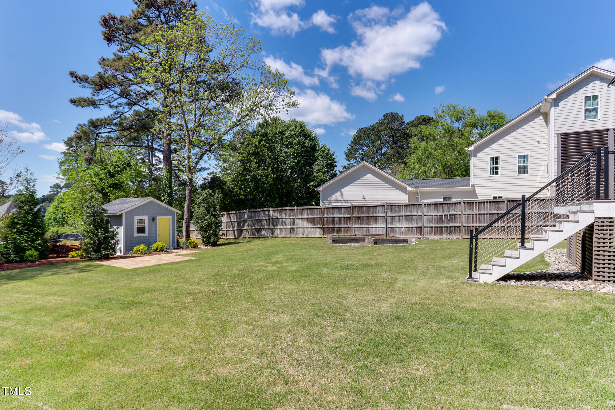 721 Shelley Road Raleigh, NC 27609 - Photo 40 of 46 a view of a house with a yard