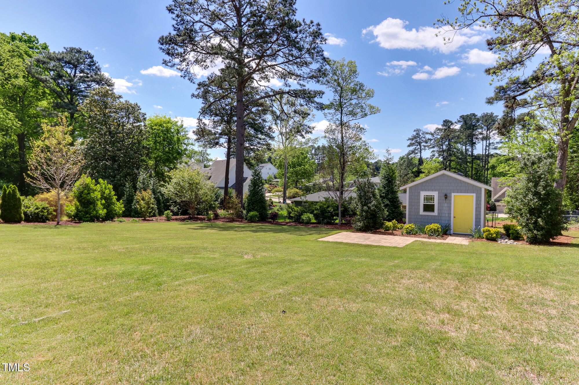 721 Shelley Road Raleigh, NC 27609 - Photo 41 of 46 a front view of a house with a yard and trees