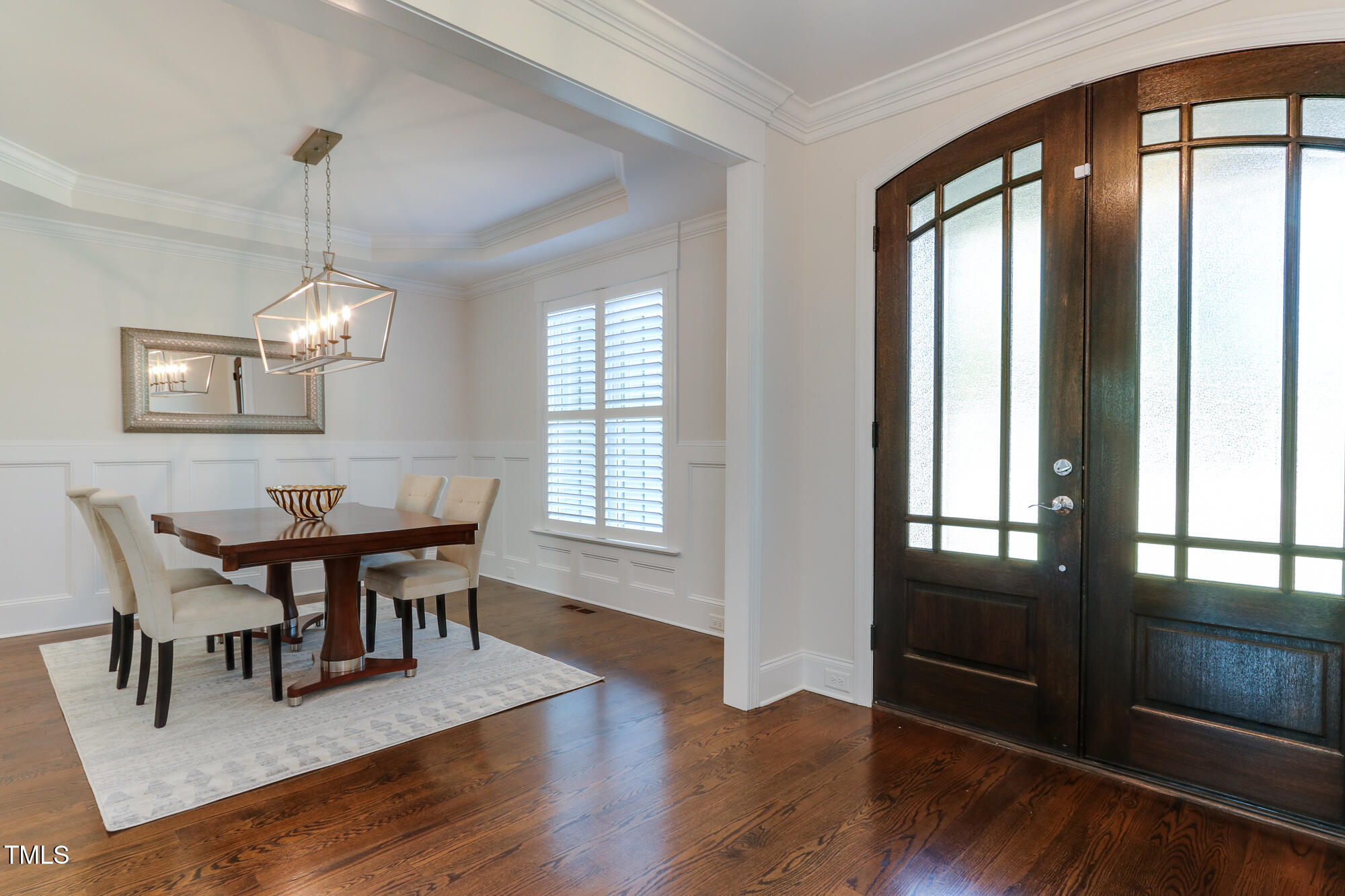 721 Shelley Road Raleigh, NC 27609 - Photo 6 of 46 a view of a dining room with furniture window and wooden floor