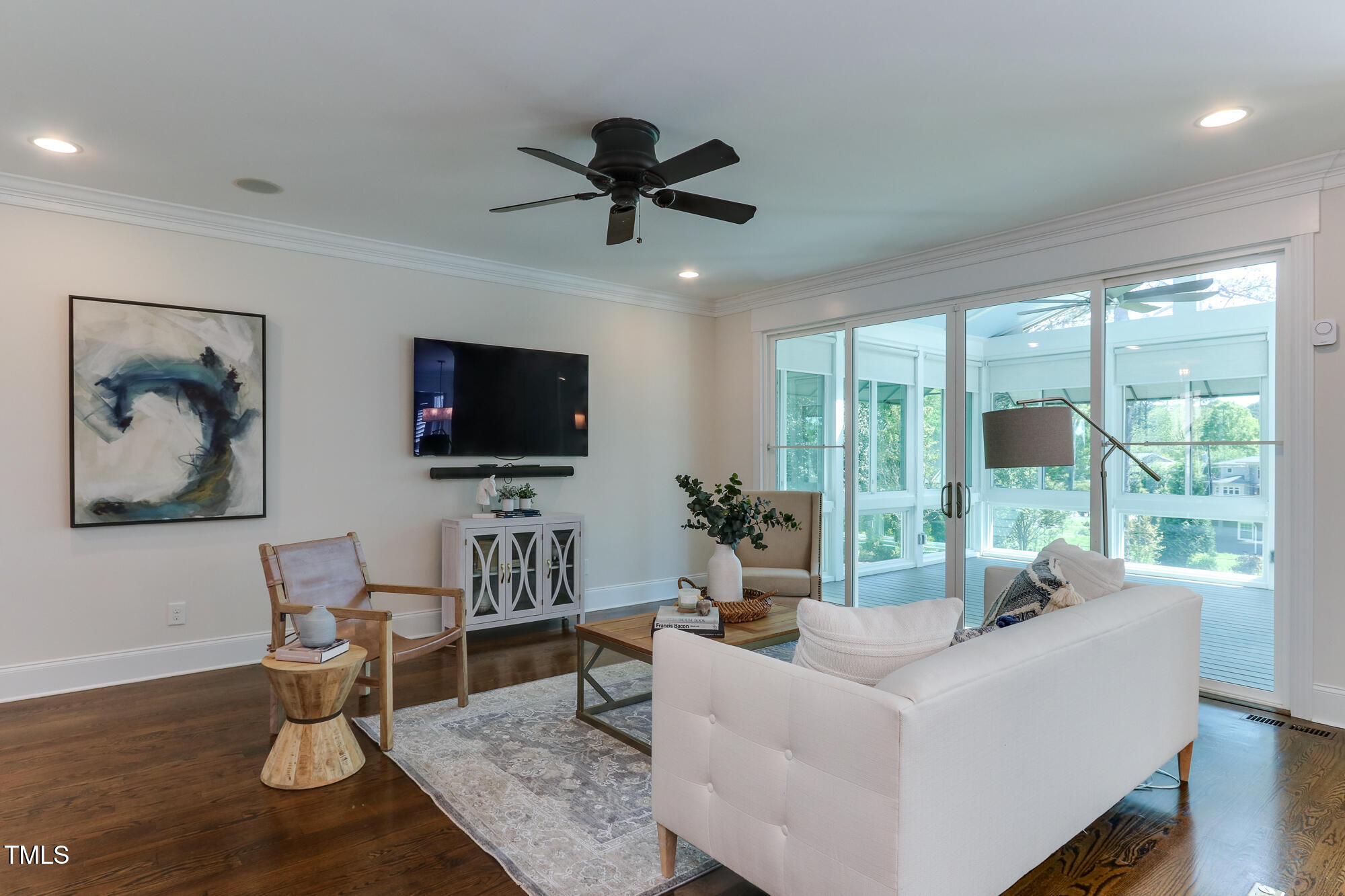 721 Shelley Road Raleigh, NC 27609 - Photo 10 of 46 a living room with furniture and a flat screen tv