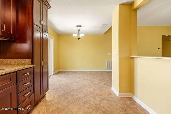 a view of a kitchen from the hallway