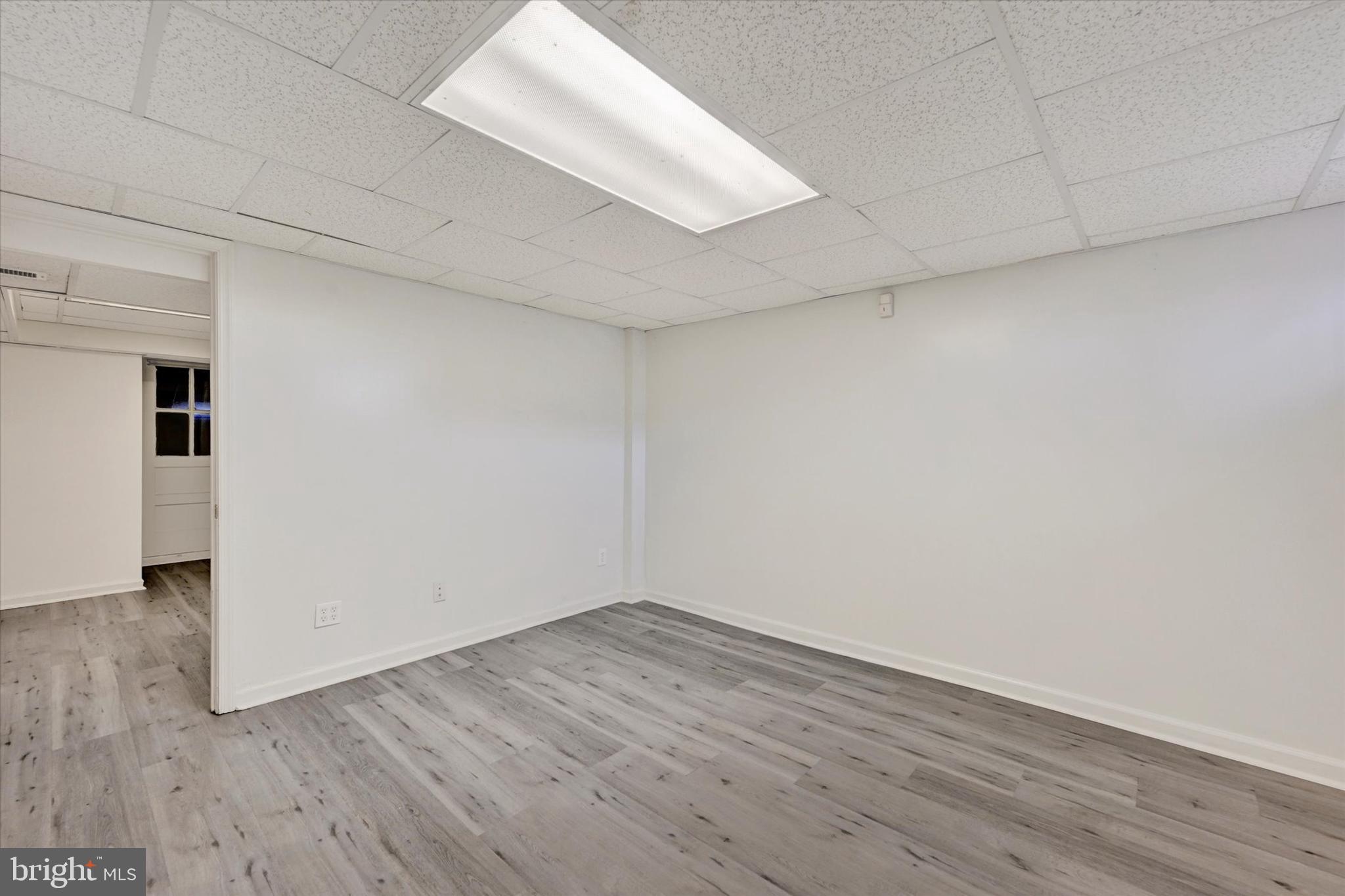 7007 Bank Street Baltimore, MD 21224 - Photo 13 of 18 wooden floor in an empty room