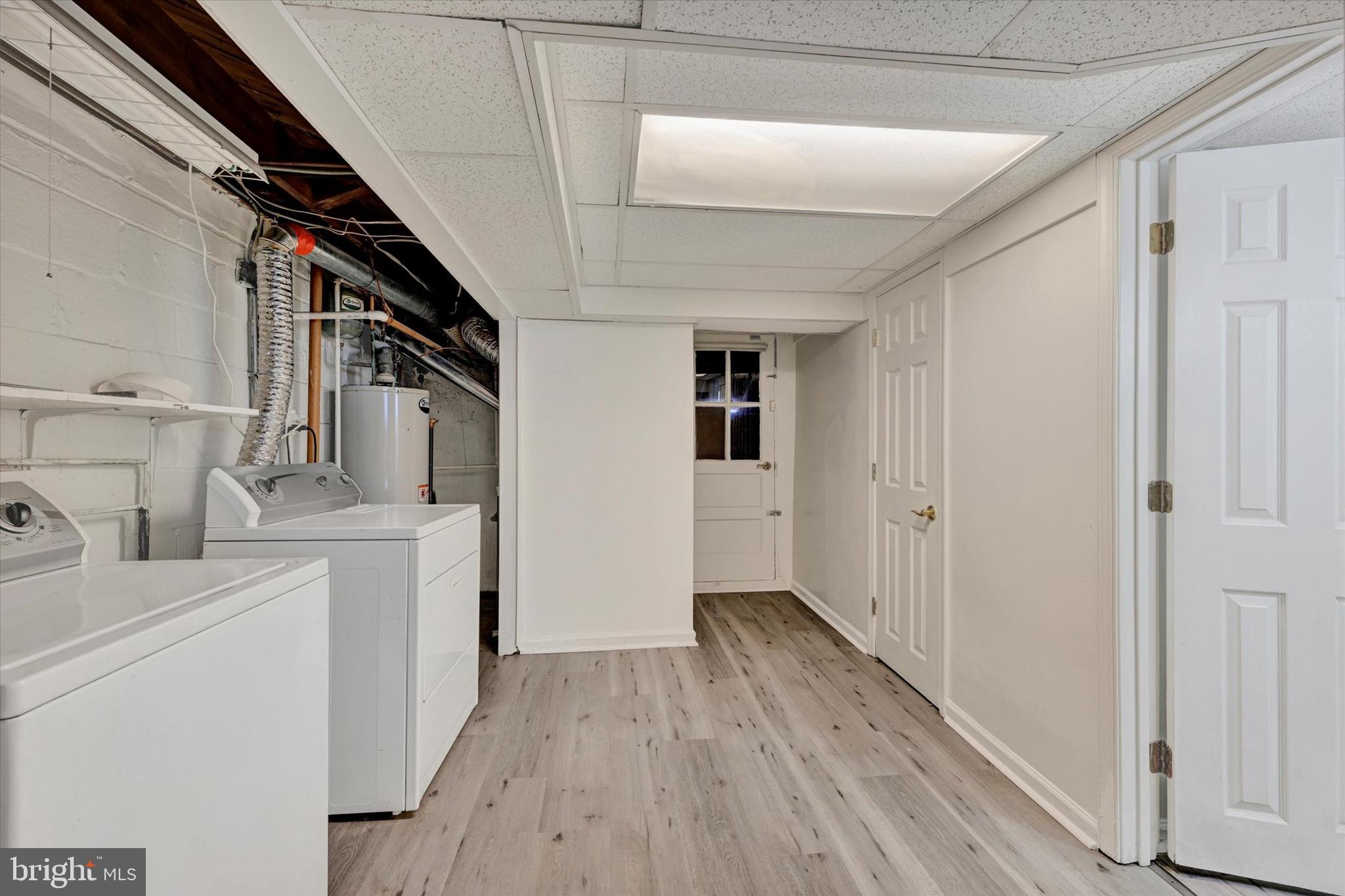 7007 Bank Street Baltimore, MD 21224 - Photo 14 of 18 a hallway with washer and dryer