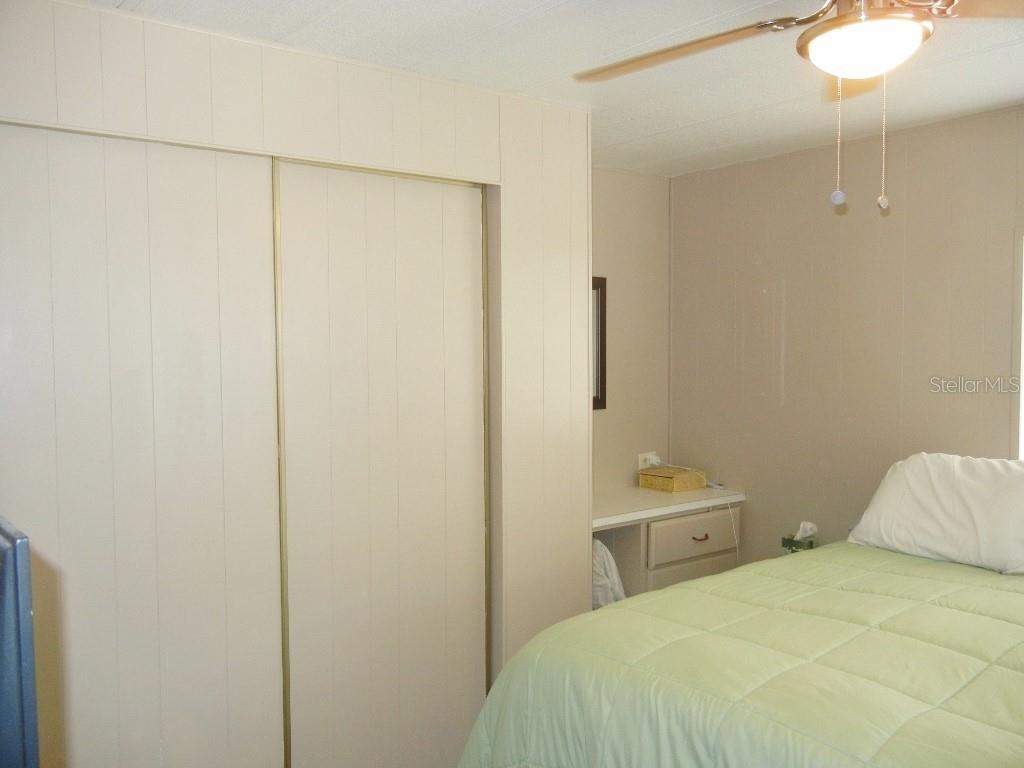 212 Rue De Pont Tavares, FL 32778 - Photo 17 of 36 a bedroom with a bed and a shower