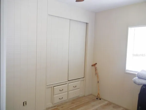 a view of storage and utility room with closet