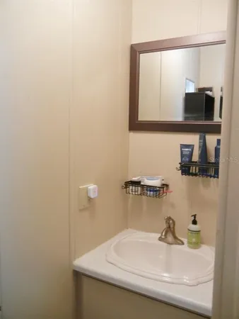 a bathroom with a sink and a mirror