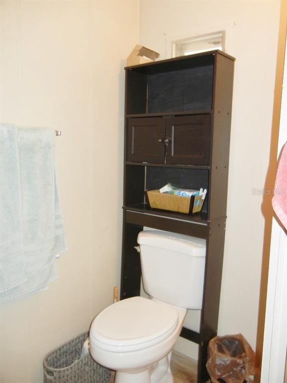 212 Rue De Pont Tavares, FL 32778 - Photo 29 of 36 a toilet sitting in a bathroom next to a sink