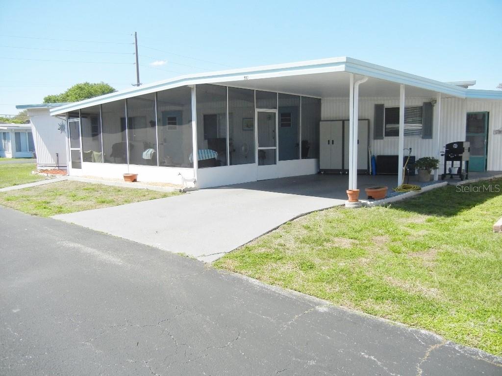 212 Rue De Pont Tavares, FL 32778 - Photo 3 of 36 a view of a house with a backyard and porch