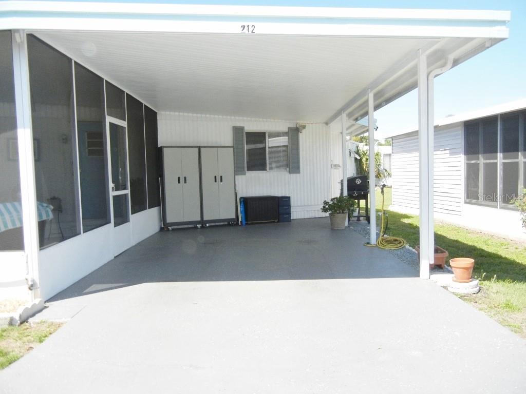 212 Rue De Pont Tavares, FL 32778 - Photo 35 of 36 a living room with furniture and a large window