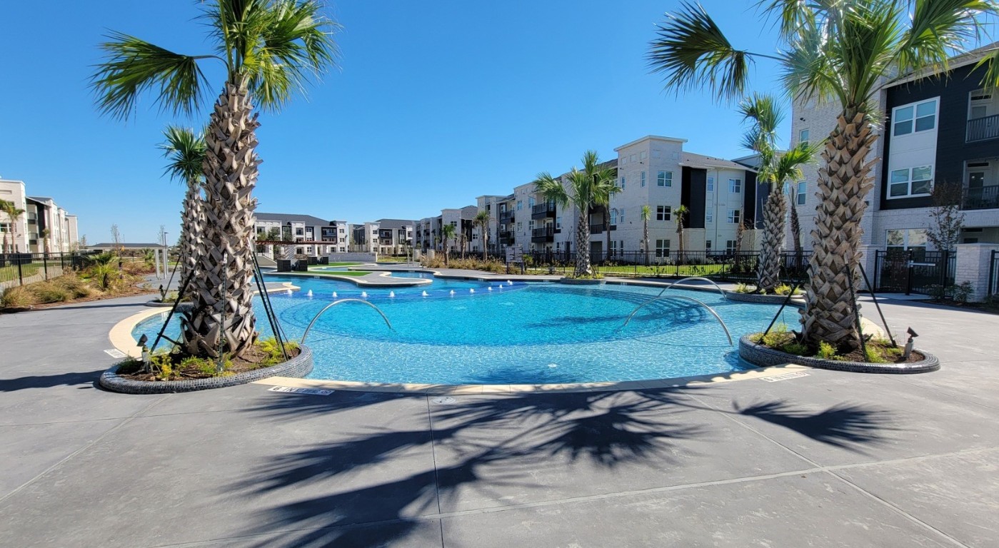 7100 Uvalde Road, Unit 6206 Houston, TX 77049 - Photo 24 of 28 a view of a park with palm trees