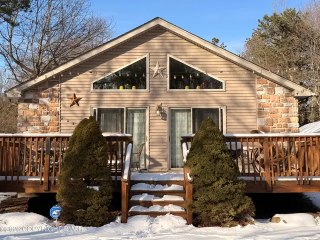 a view of a house with a tree