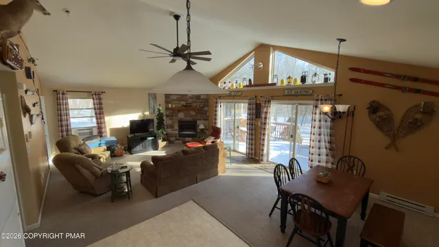 a living room with furniture a window and a chandelier