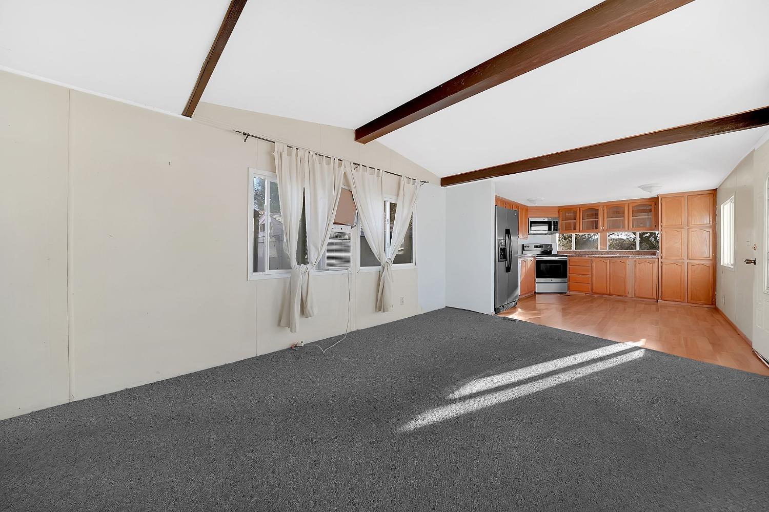 2000 Camanche Road, Unit 16 Ione, CA 95640 - Photo 17 of 36 a view of empty room with wooden floor