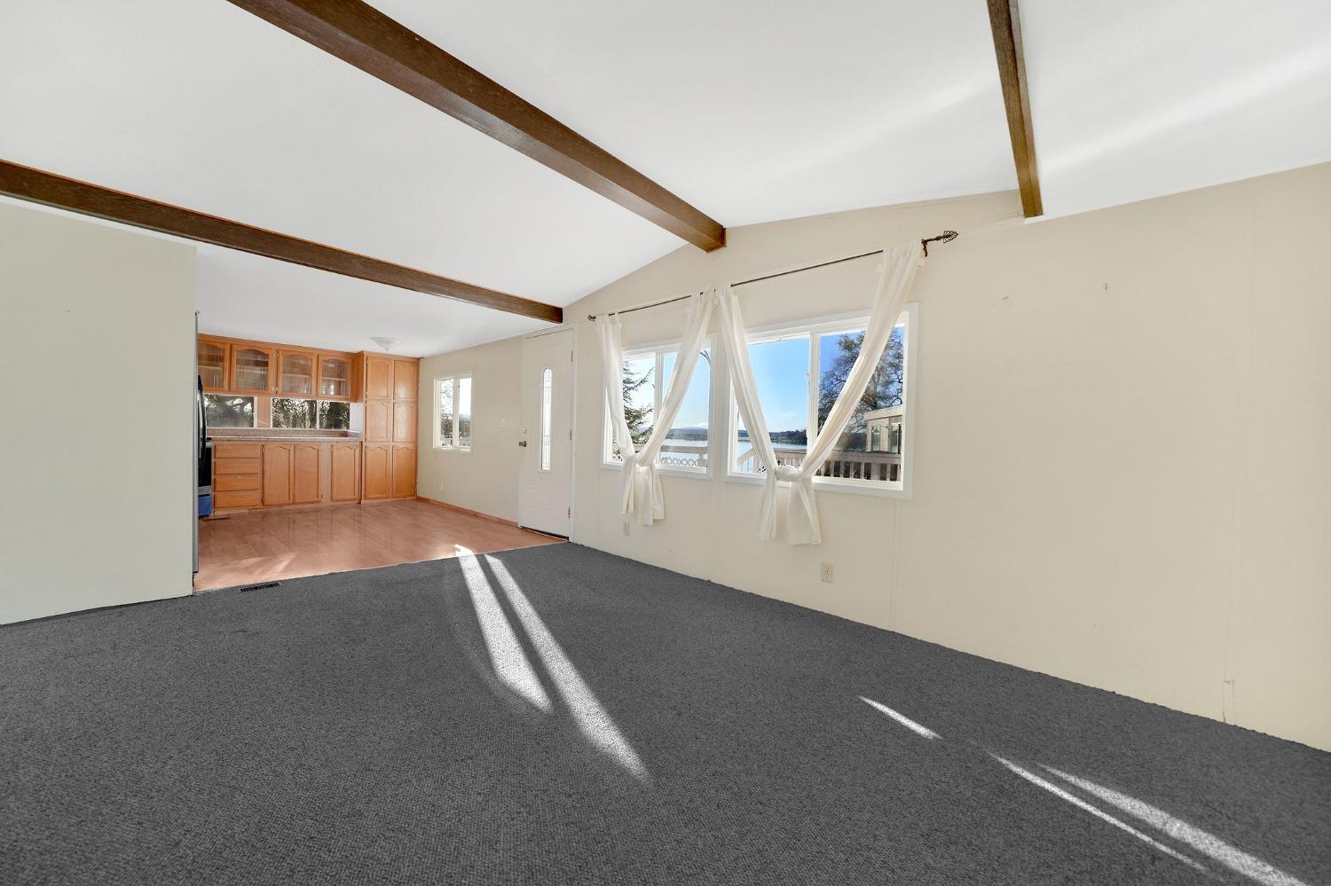 2000 Camanche Road, Unit 16 Ione, CA 95640 - Photo 18 of 36 a view of an empty room with wooden floor