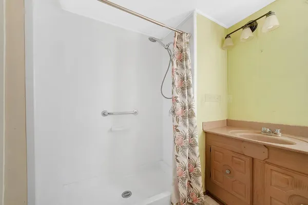 a view of an empty room with a window