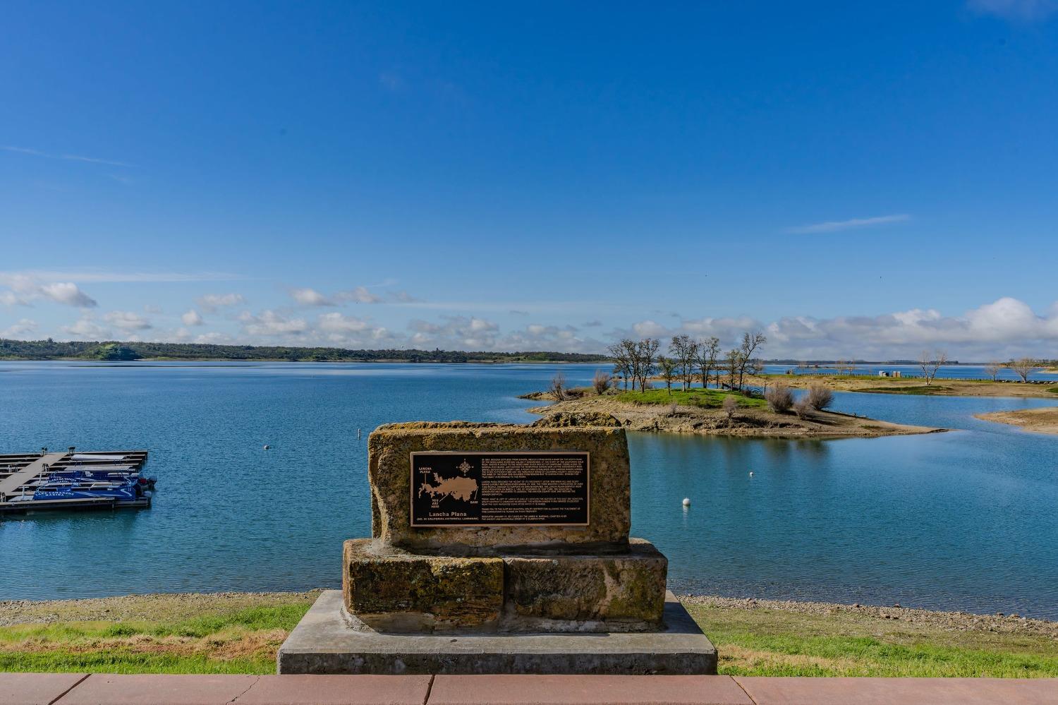 2000 Camanche Road, Unit 16 Ione, CA 95640 - Photo 31 of 36 a view of a lake with lawn chairs
