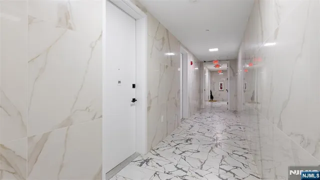 a bathroom with a shower and a sink
