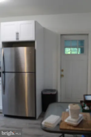 a kitchen with a sink cabinets and window