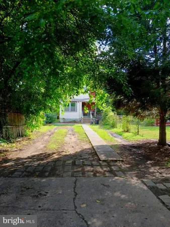 a view of a tree in front of a house